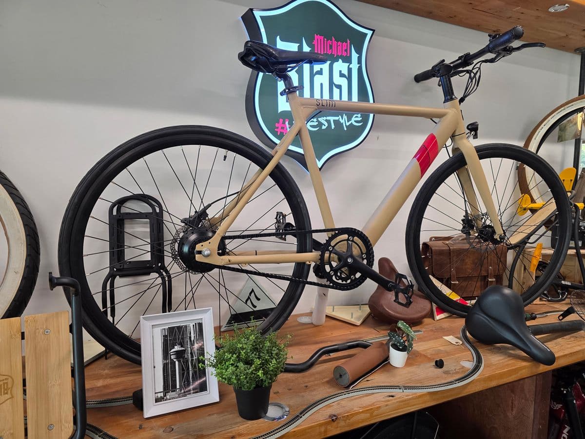 Bike detail display with neon Michael Blast Lifestyle sign